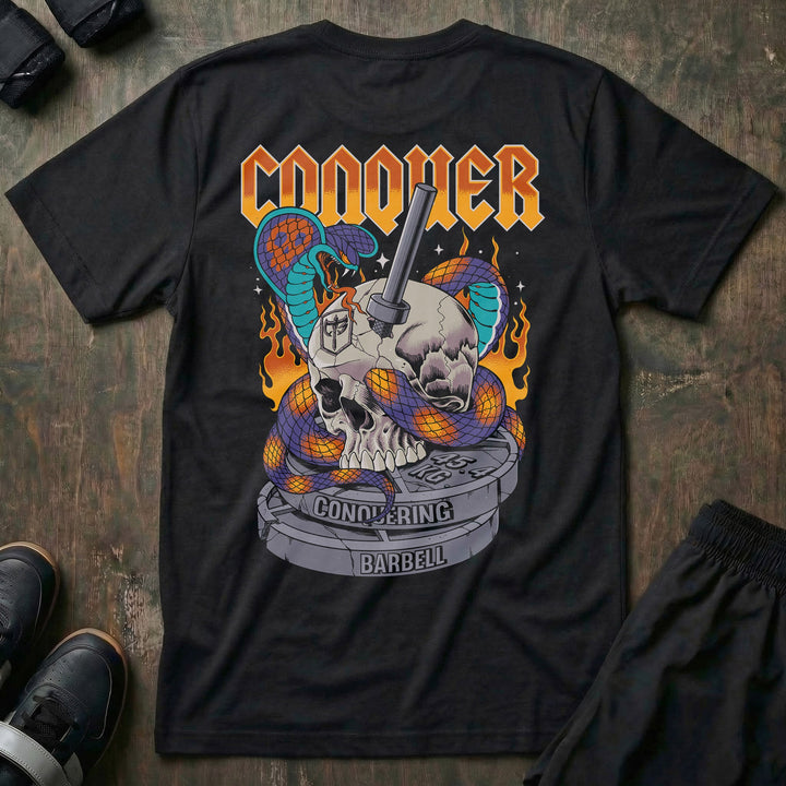 Conquer King Cobra tee in Black: a skull with twin king cobras coiled through it and a barbell piercing the center