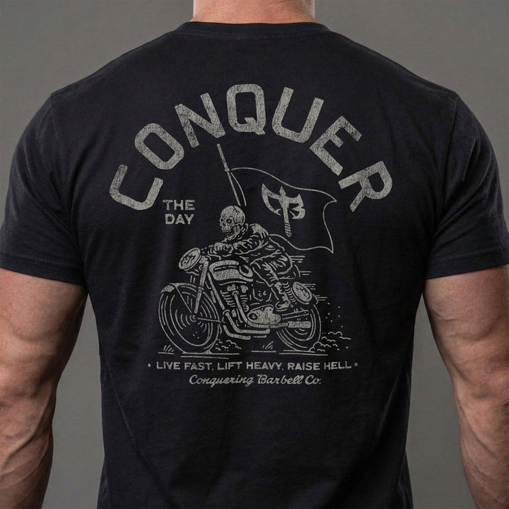 Conquer Motorcycle Club tee in Black: a skeleton rider flying the CB flag on his chopper