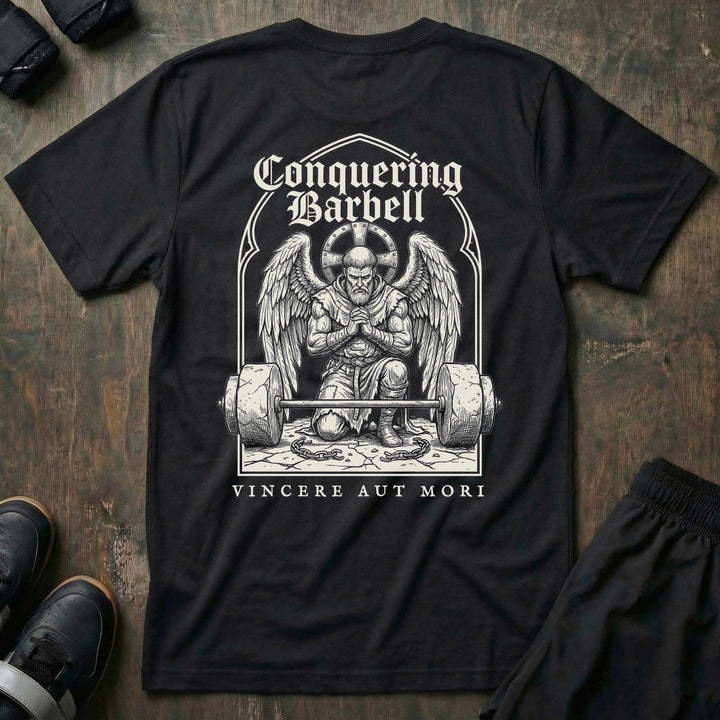 Conquer or Die Monk tee in Black: a winged warrior angel kneeling over a barbell inside a gothic archway