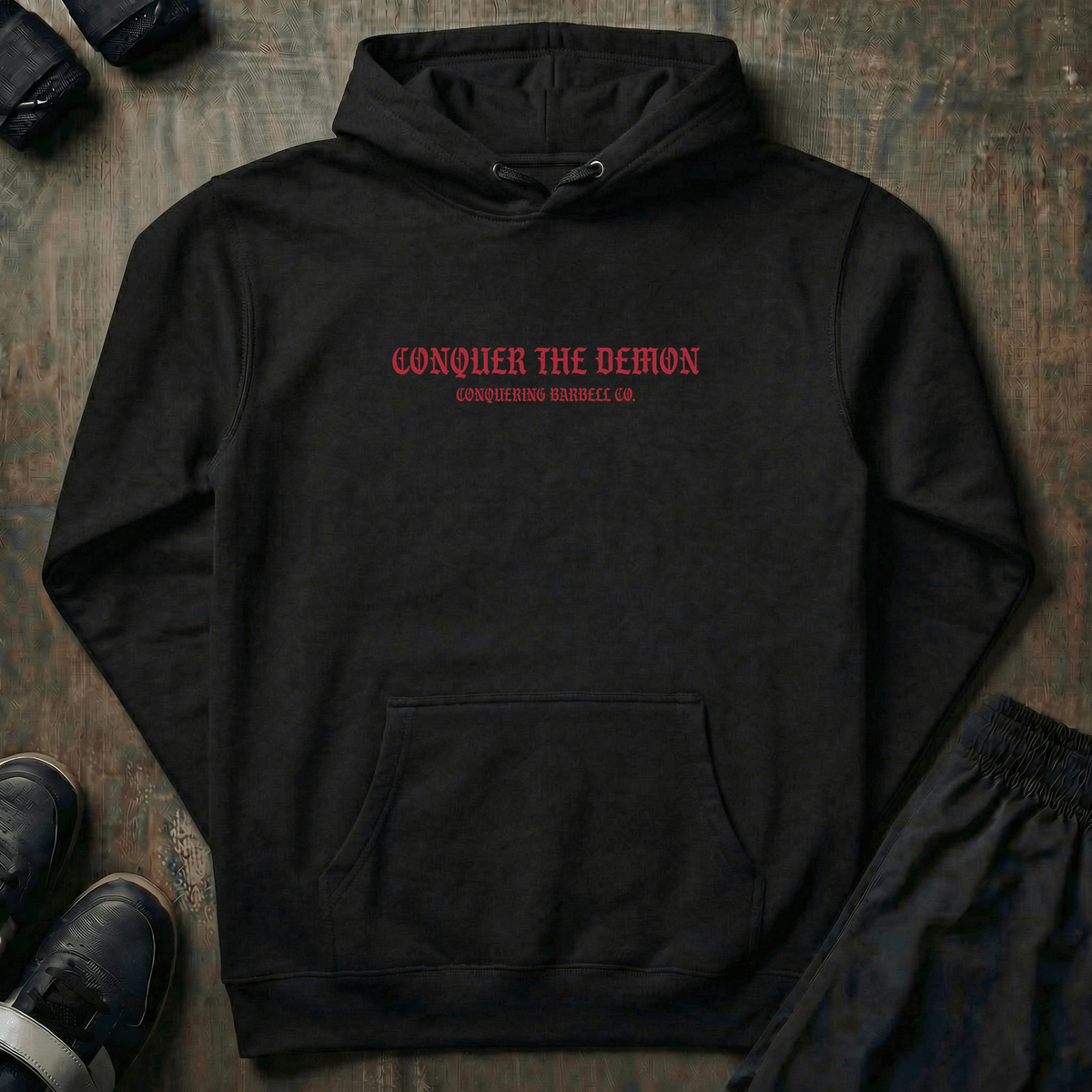 Conquer the Demon pullover hoodie in Black: a battle-worn samurai holding a defeated oni mask
