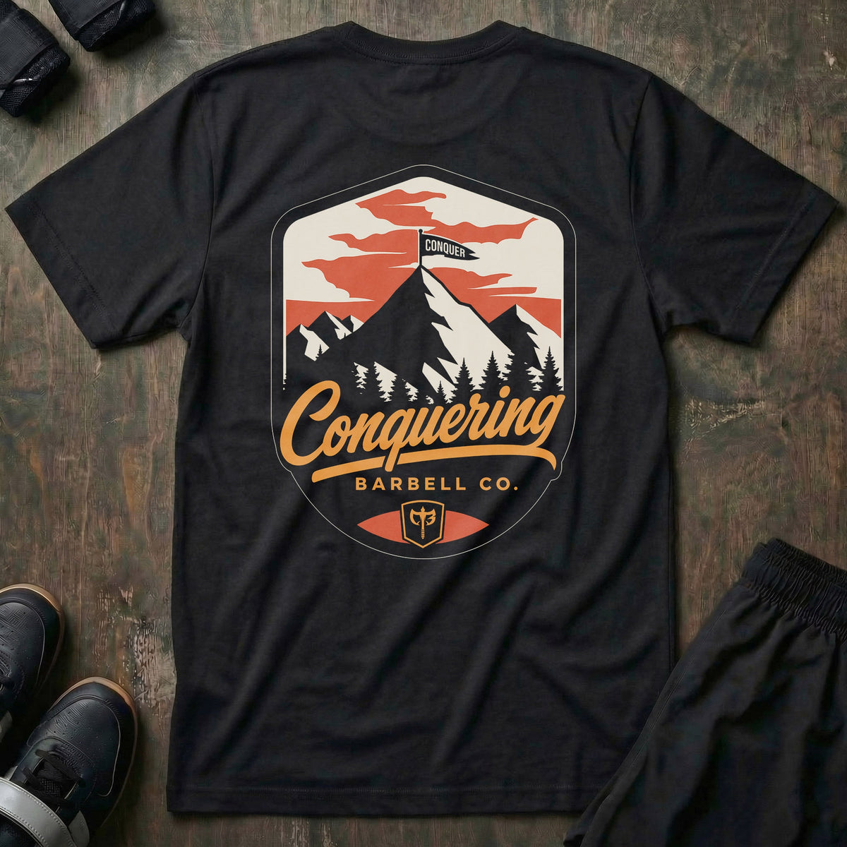 Conquer the Summit tee in Black: a bold outdoor badge with snow-capped peaks above a pine tree line
