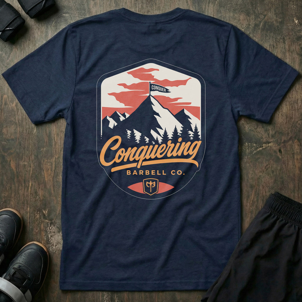Conquer the Summit tee in Navy: a bold outdoor badge with snow-capped peaks above a pine tree line