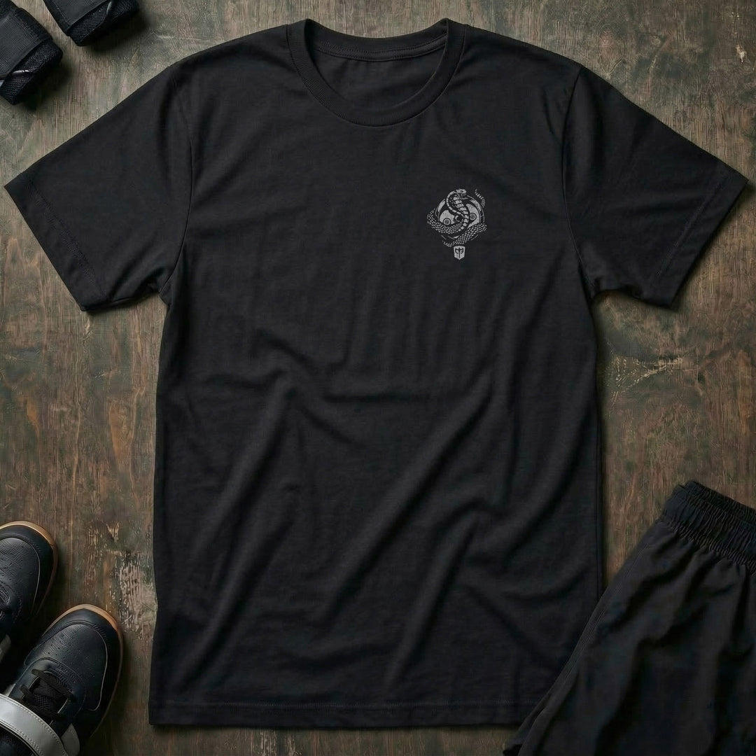 Conquer the Weights Cobra tee in Black: a coiled cobra rising over the CB shield inside a circular badge