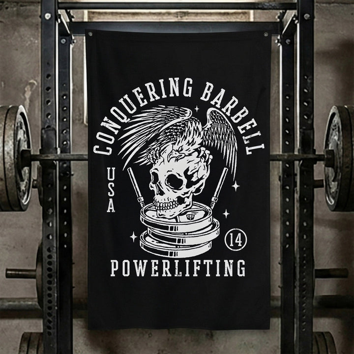Conquering Barbell Eagle Powerlifting - Polyester Flag, vertical black gym flag with eagle perched on a skull atop stacked plates - Conquering Barbell
