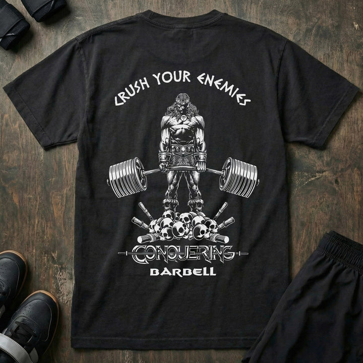 Crush Your Enemies relaxed fit tee in Black: a barbarian warrior deadlifting a massive barbell while standing