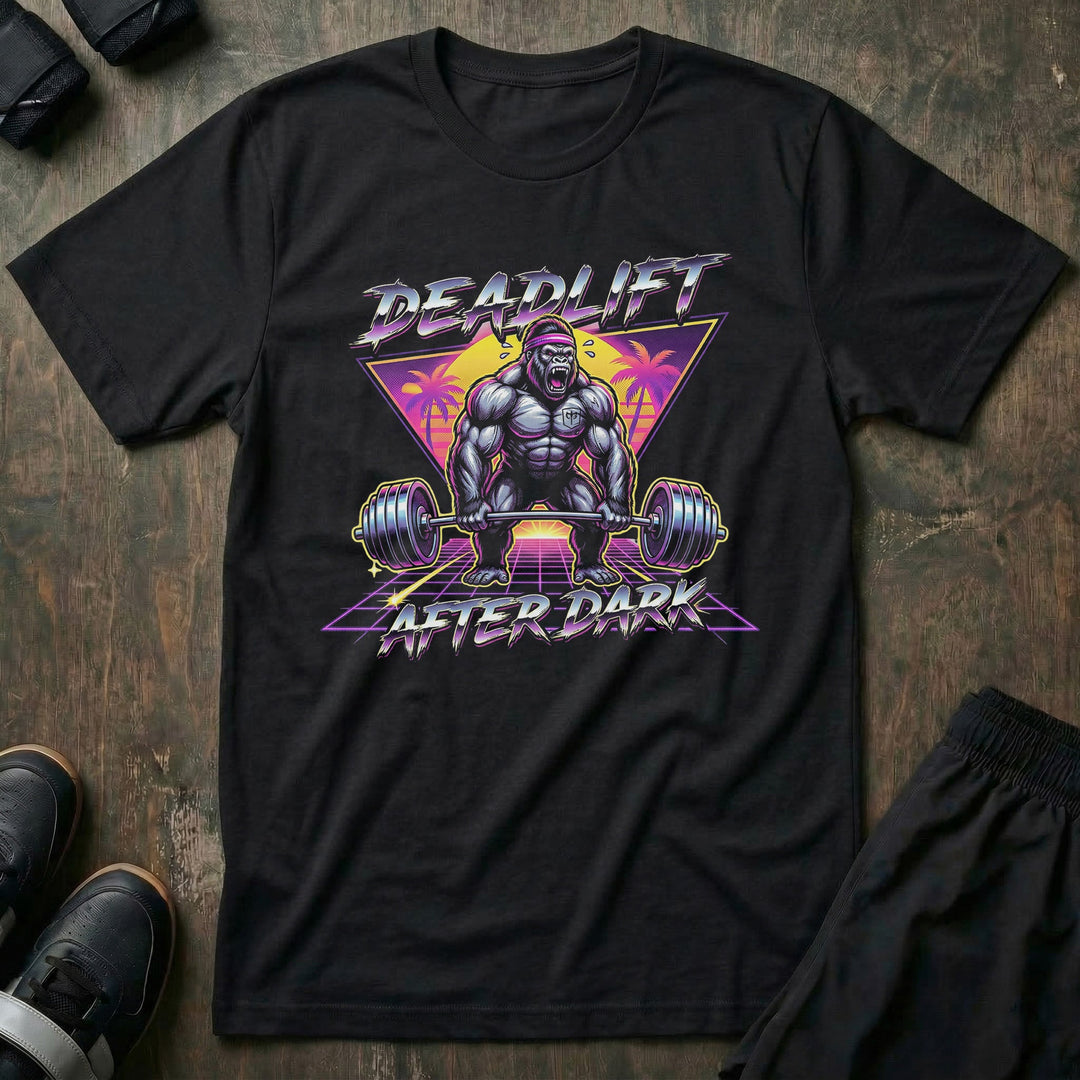 Deadlift After Dark tee in Black: a retro 80s-style gorilla pulling heavy in front of a neon triangle and palm trees