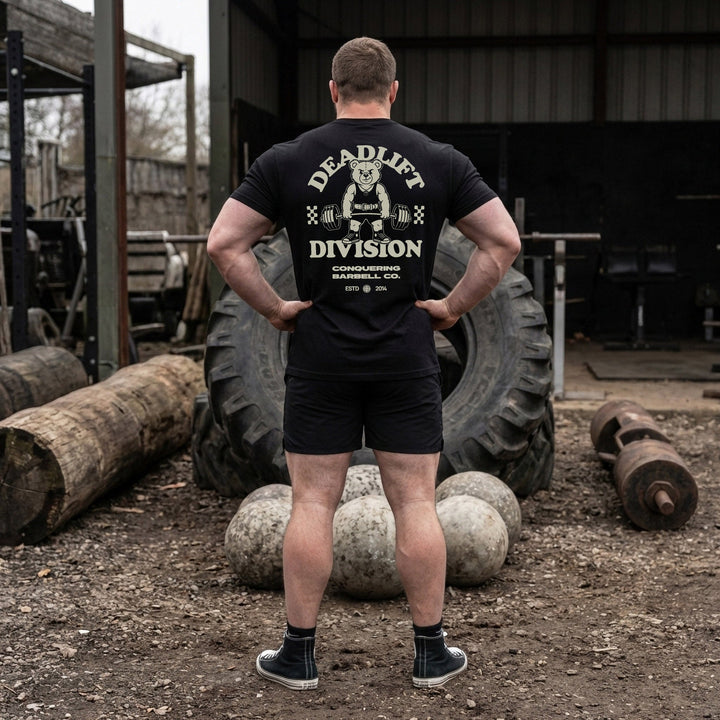 Deadlift Division tee: a classic teddy bear pulling heavy in a lifting belt