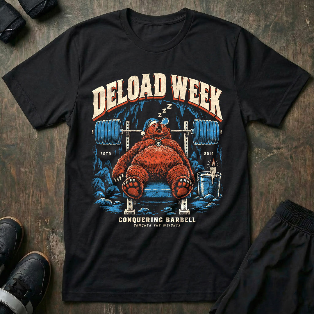 Deload Week - Tee front graphic in Black with a bear in a nightcap asleep on the bench under a loaded barbell - Conquering Barbell