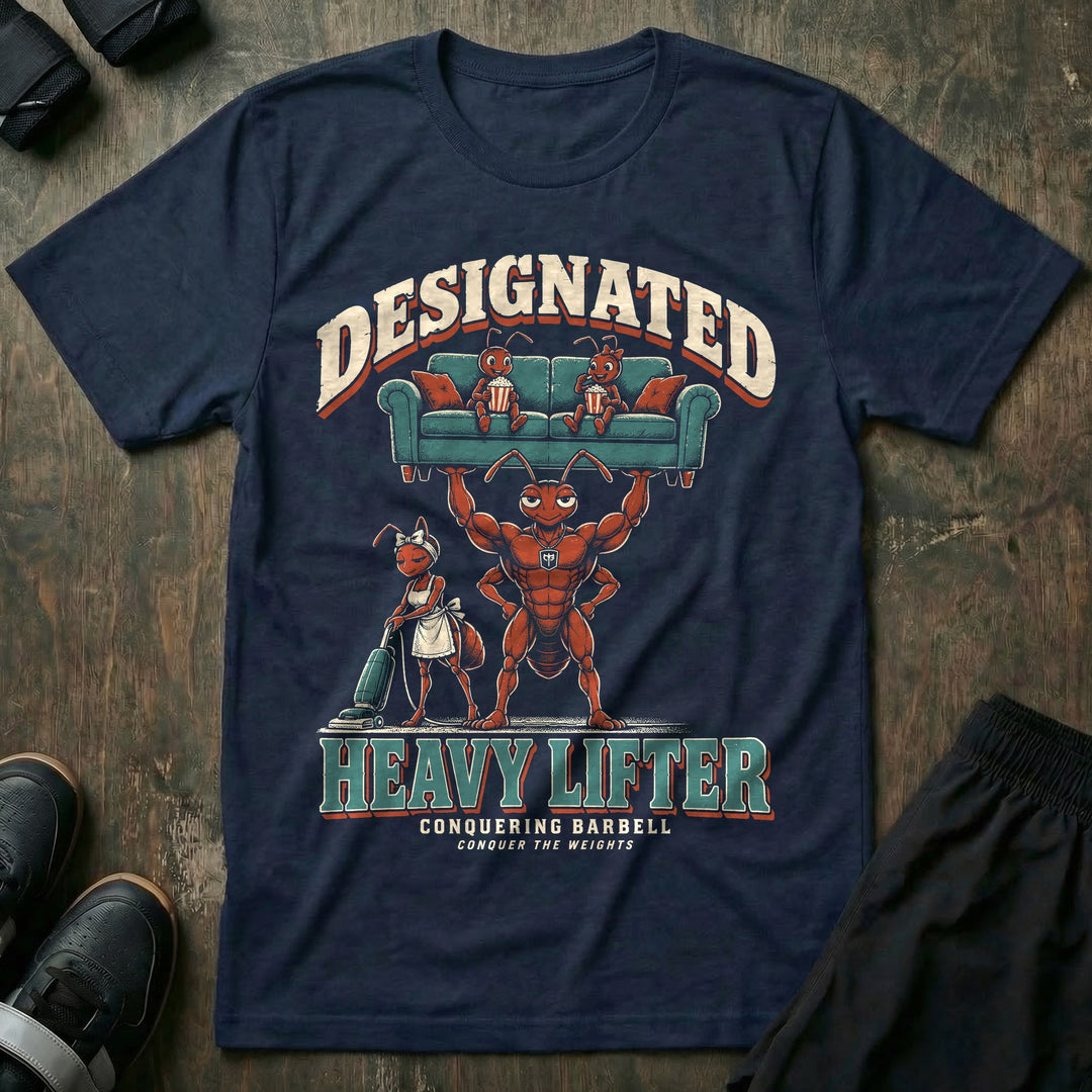 Designated Heavy Lifter - Tee front graphic in Navy with a muscular ant dad lifting a couch overhead with two young ants eating popcorn on it while another ant vacuums below - Conquering Barbell