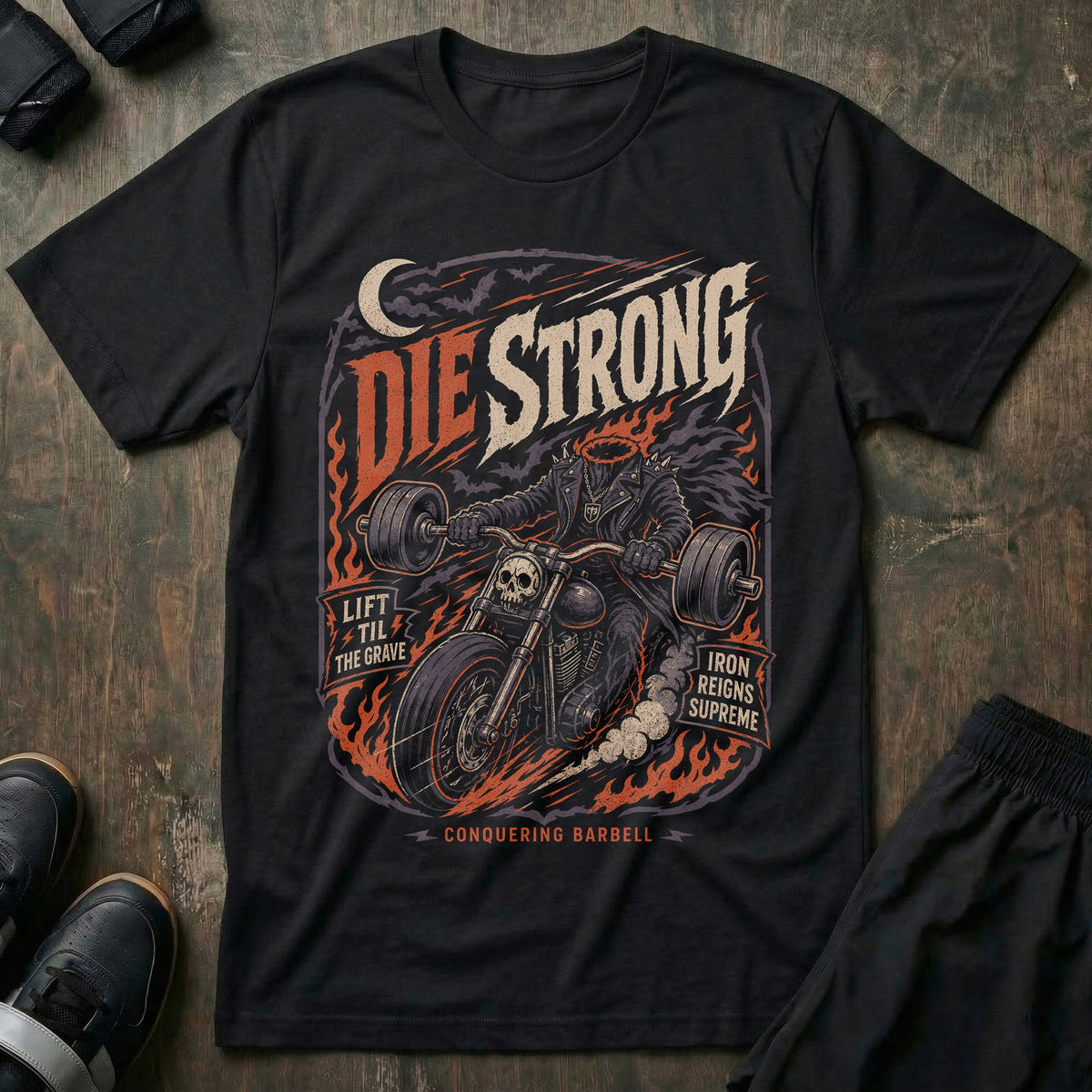 Die Strong Headless Biker tee in Black: a headless rider on a skull-nosed chopper carrying a loaded barbell instead