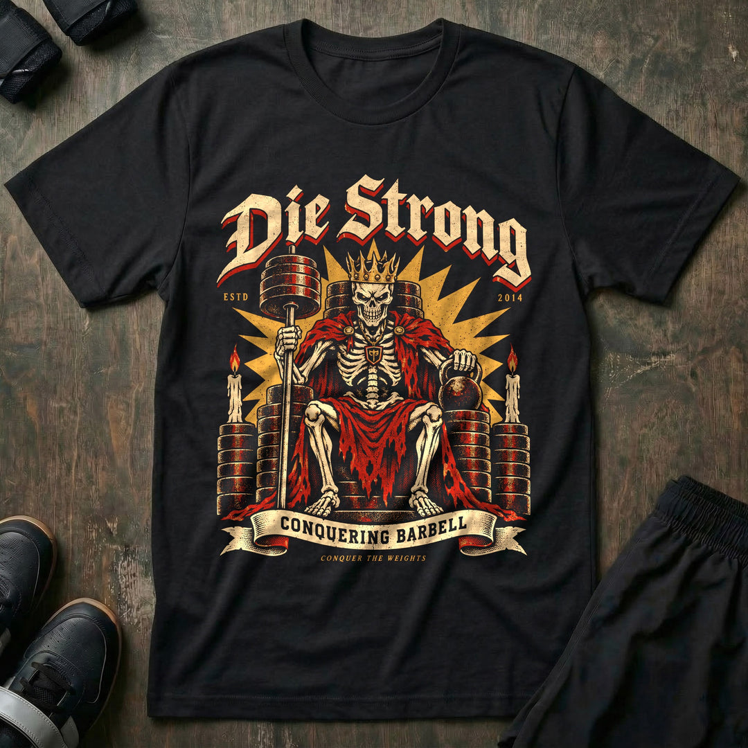 Die Strong - Tee front graphic in Black with a crowned skeleton king seated on a throne of weight plates - Conquering Barbell