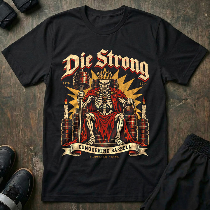 Die Strong - Tee front graphic in Black with a crowned skeleton king seated on a throne of weight plates - Conquering Barbell
