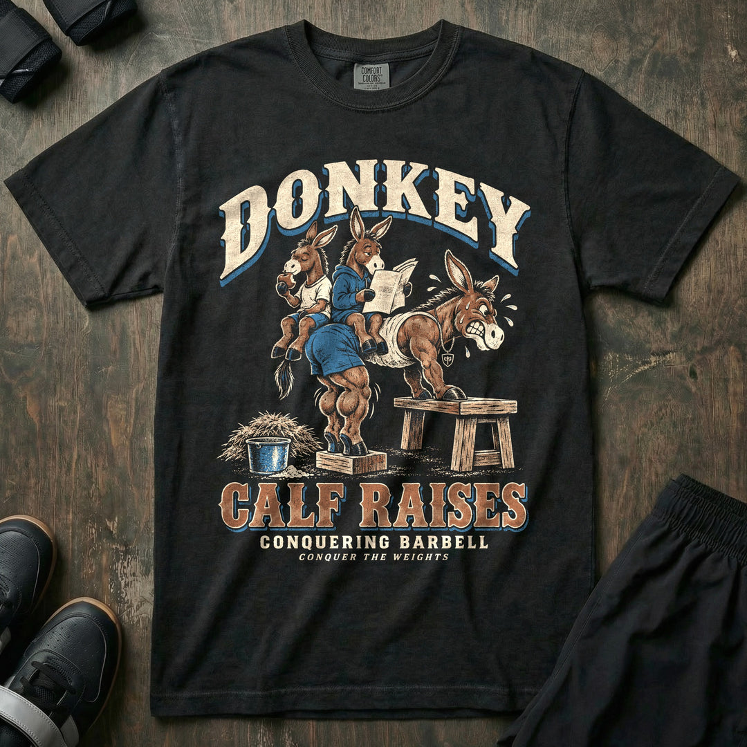Donkey Calf Raises - Relaxed Fit Tee front graphic in Black with a donkey doing donkey calf raises with two other donkeys sitting on its back - Conquering Barbell