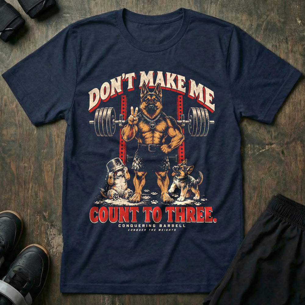 Don't Make Me Count to Three - Tee front graphic in Navy with a German shepherd dad holding up two fingers in front of a squat rack while two puppies play in spilled chalk - Conquering Barbell