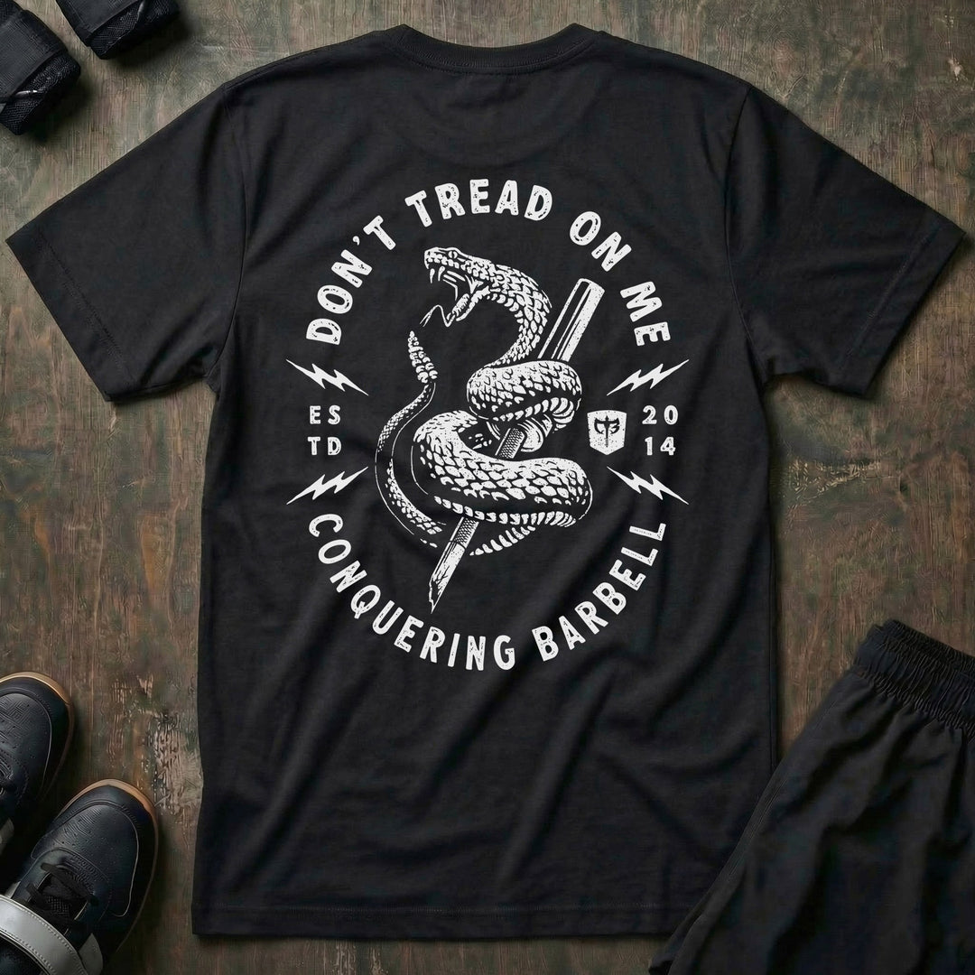 Don't Tread on Me (Version 2) tee in Black: a coiled rattlesnake wrapped around a barbell inside a round badge