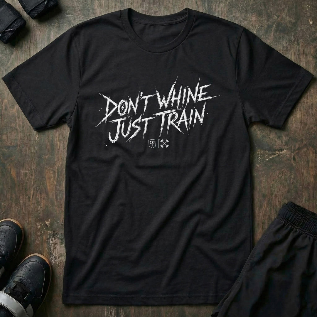 Don't Whine Just Train tee in Black: DON'T WHINE JUST TRAIN in raw white brush script with small CB marks below