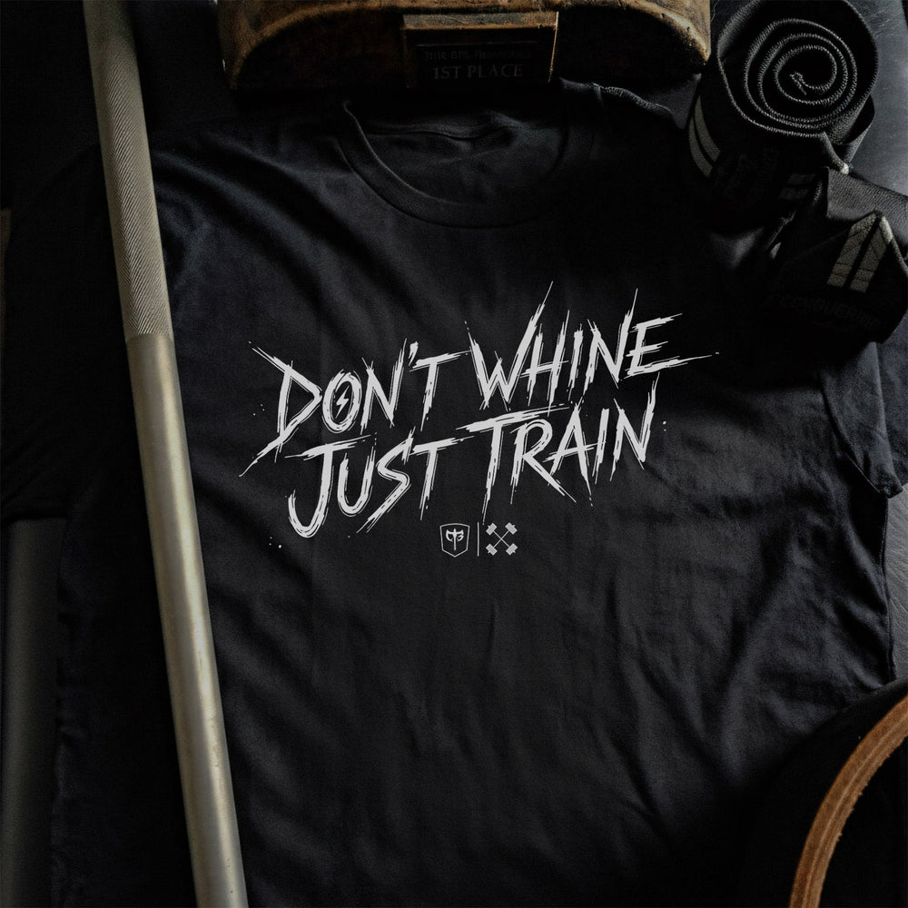 Don't Whine Just Train tee in Black: DON'T WHINE JUST TRAIN in raw white brush script with small CB marks below