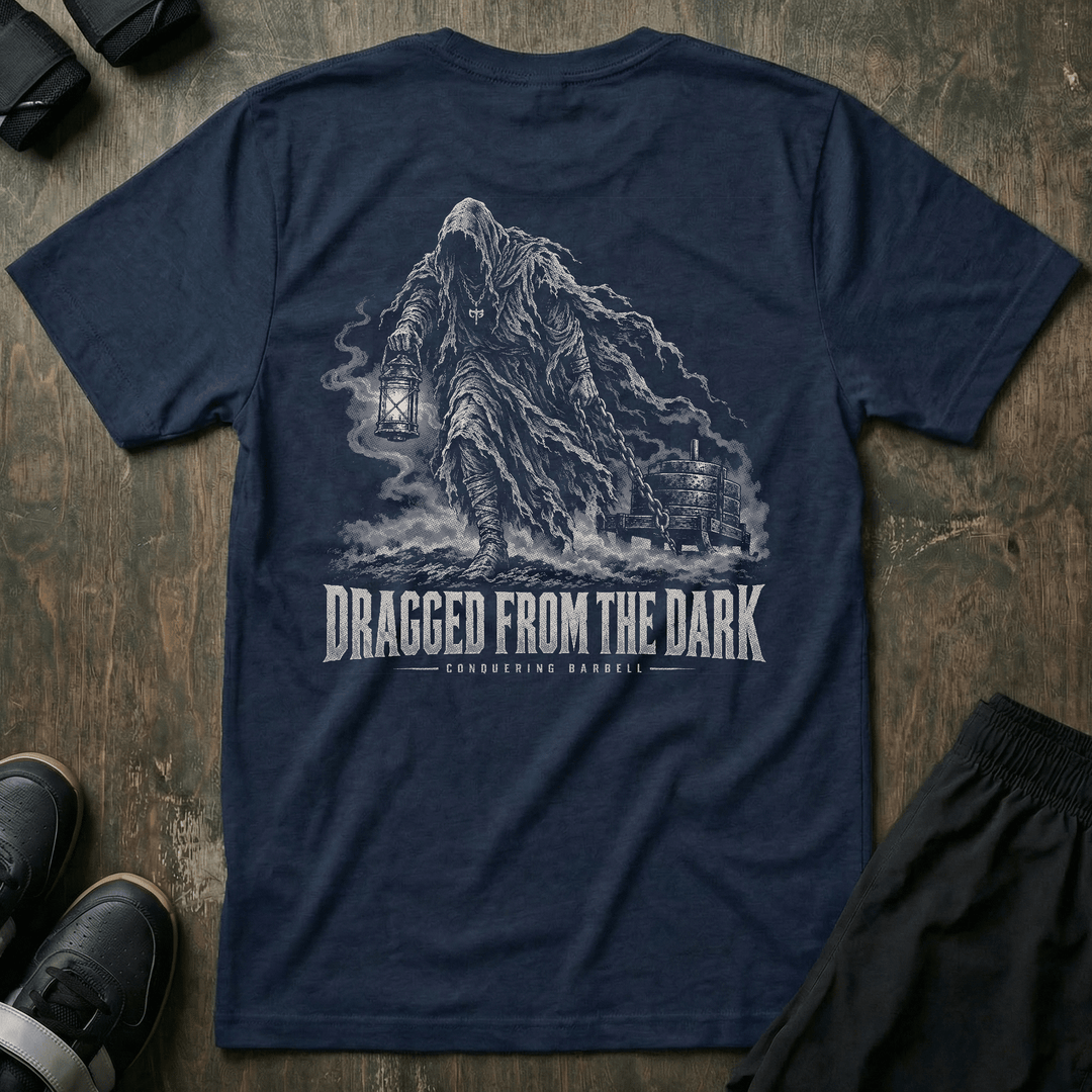 Dragged from the Dark tee in Navy: a faceless hooded figure carrying a smoking lantern