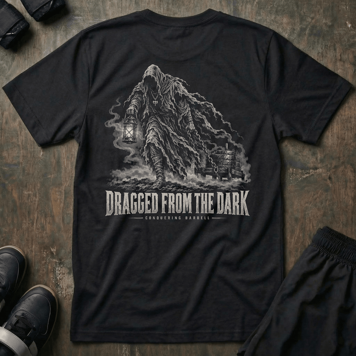 Dragged from the Dark tee in Black: a faceless hooded figure carrying a smoking lantern