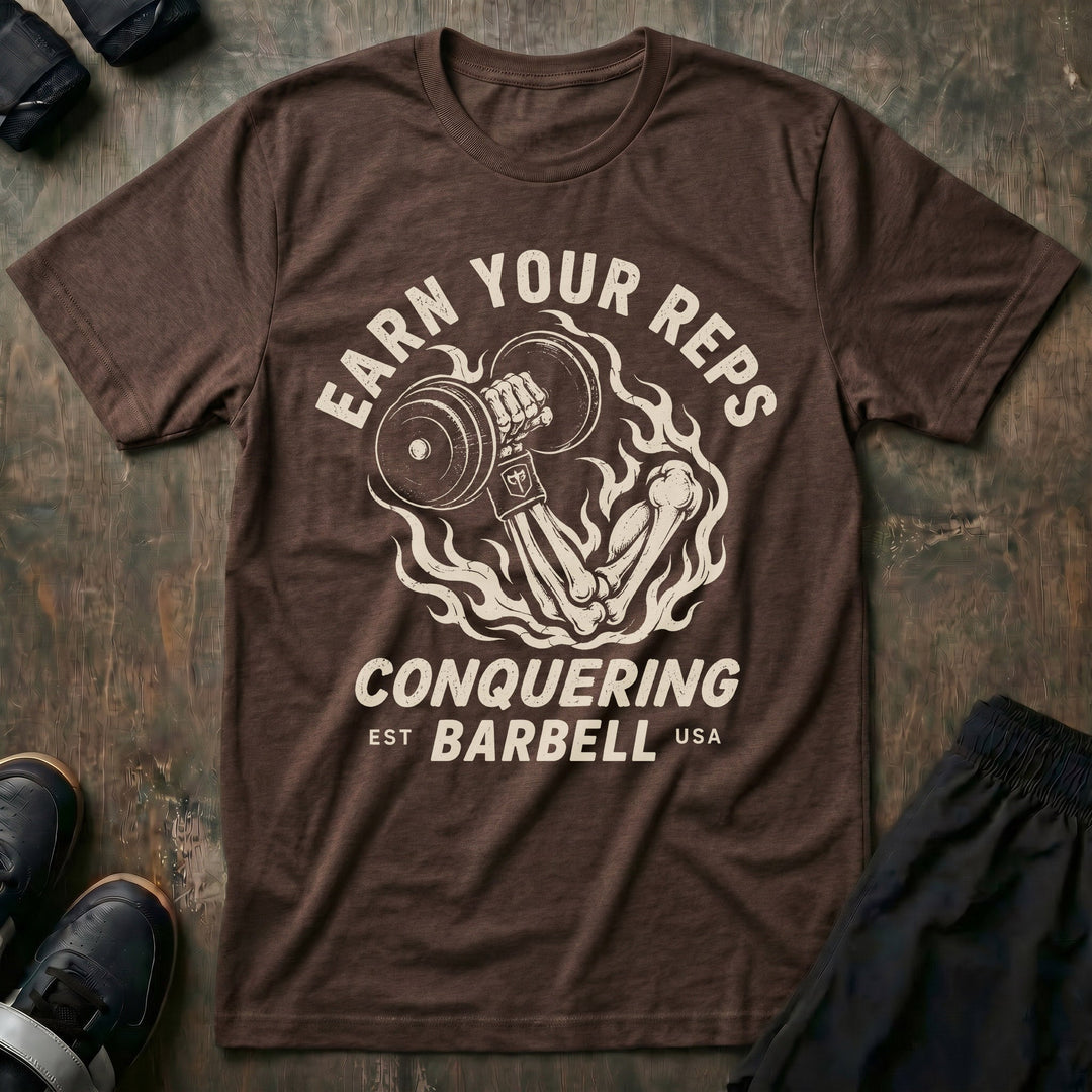 Earn Your Reps tee in Expresso: a skeletal hand rising from a ring of fire gripping a loaded dumbbell