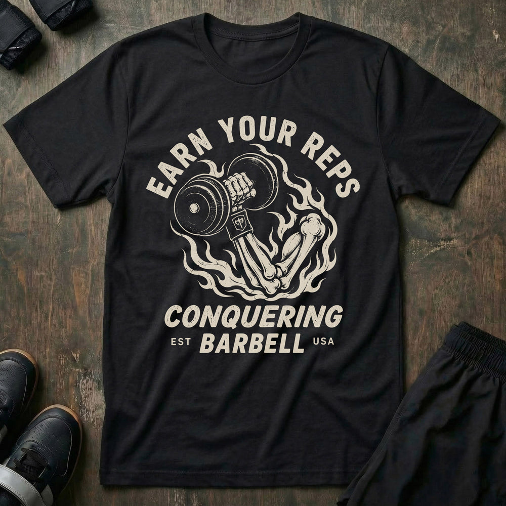 Earn Your Reps tee in Black: a skeletal hand rising from a ring of fire gripping a loaded dumbbell