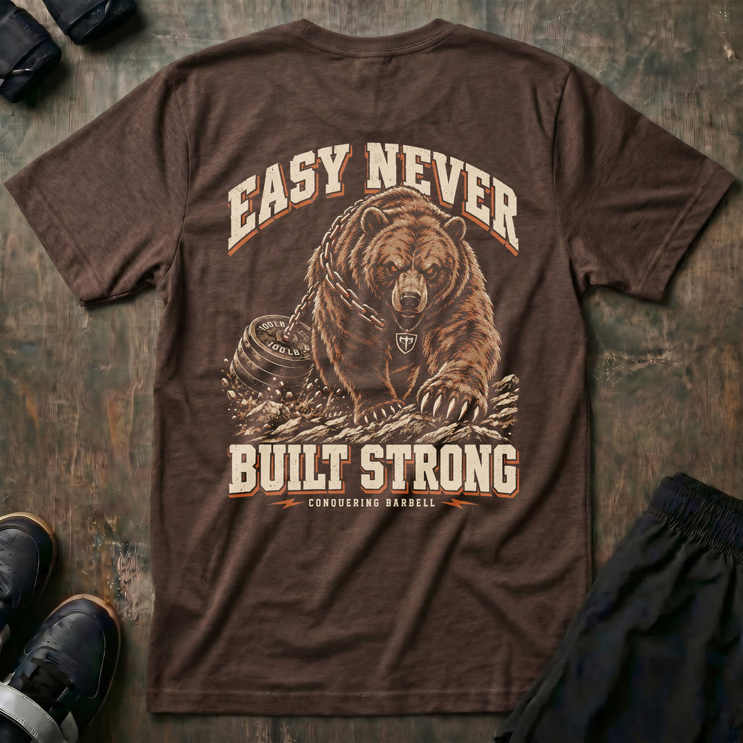 Easy Never Built Strong relaxed fit tee in Expresso: a massive grizzly driving forward