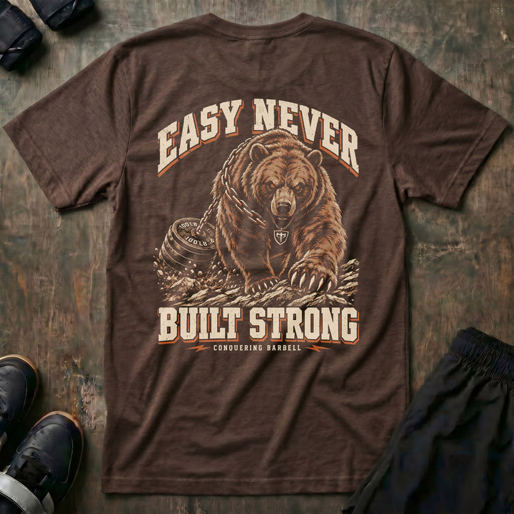 Easy Never Built Strong relaxed fit tee in Expresso: a massive grizzly driving forward