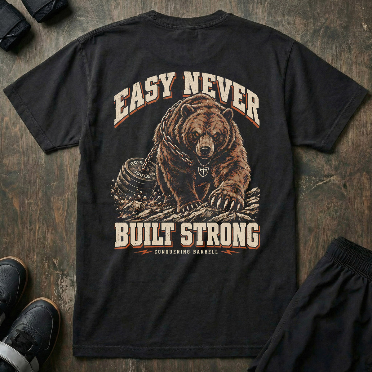 Easy Never Built Strong relaxed fit tee in Black: a massive grizzly driving forward