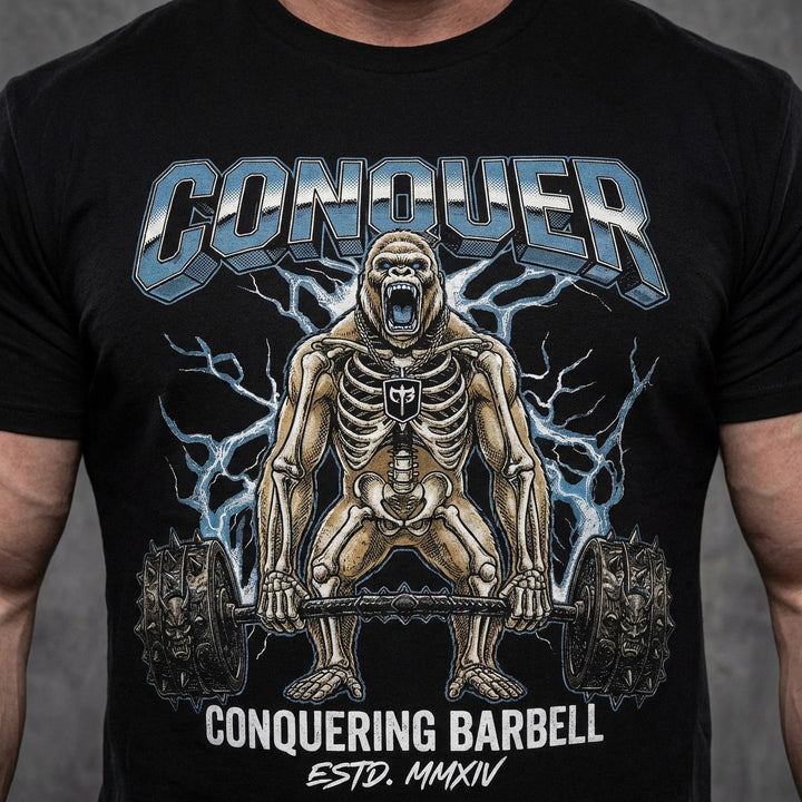 Electric Gorilla tee in Black: a skeleton gorilla locked in at the top of a deadlift with a spiked barbell loaded heavy