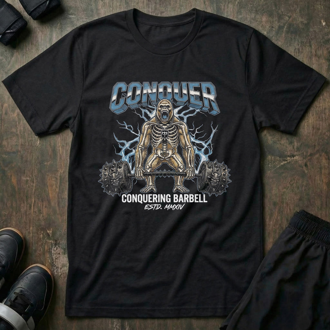 Electric Gorilla tee in Black: a skeleton gorilla locked in at the top of a deadlift with a spiked barbell loaded heavy