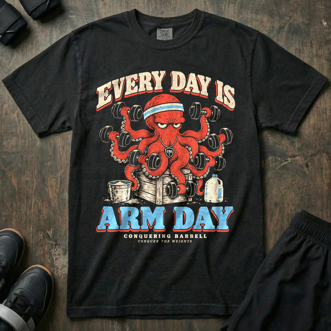 Every Day Is Arm Day - Relaxed Fit Tee front graphic in Black with a red octopus curling a dumbbell in every arm - Conquering Barbell