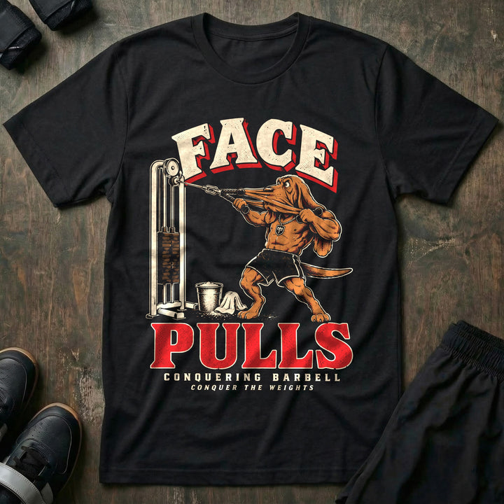 Face Pulls - Tee front graphic in Black with a bloodhound doing face pulls at a cable machine with his face stretched by the rope - Conquering Barbell
