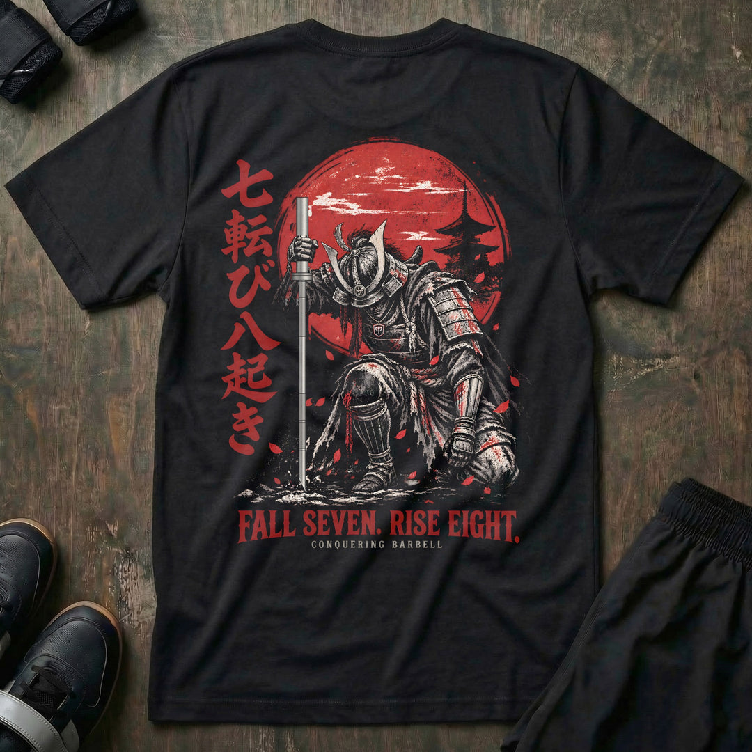 Fall Seven Rise Eight tee in Black, back print: samurai rising with a barbell-katana before a red sun