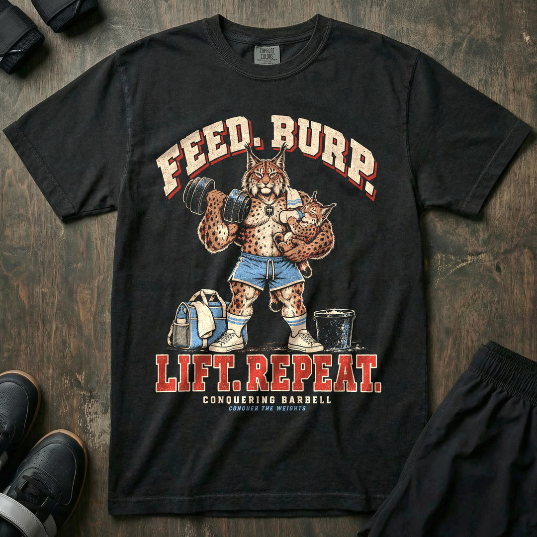 Feed. Burp. Lift. Repeat - Relaxed Fit Tee front graphic in Black with a lynx dad curling a dumbbell while bottle-feeding a baby lynx with a burp cloth on his shoulder - Conquering Barbell