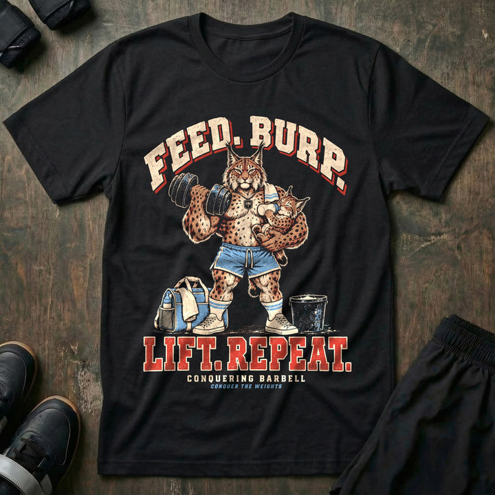 Feed. Burp. Lift. Repeat - Tee front graphic in Black with a lynx dad curling a dumbbell while bottle-feeding a baby lynx with a burp cloth on his shoulder - Conquering Barbell