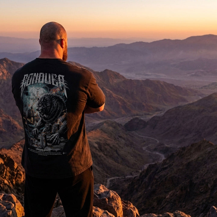 Fenrir relaxed fit tee in Black: an unstoppable wolf warrior standing amidst the ruins of battle
