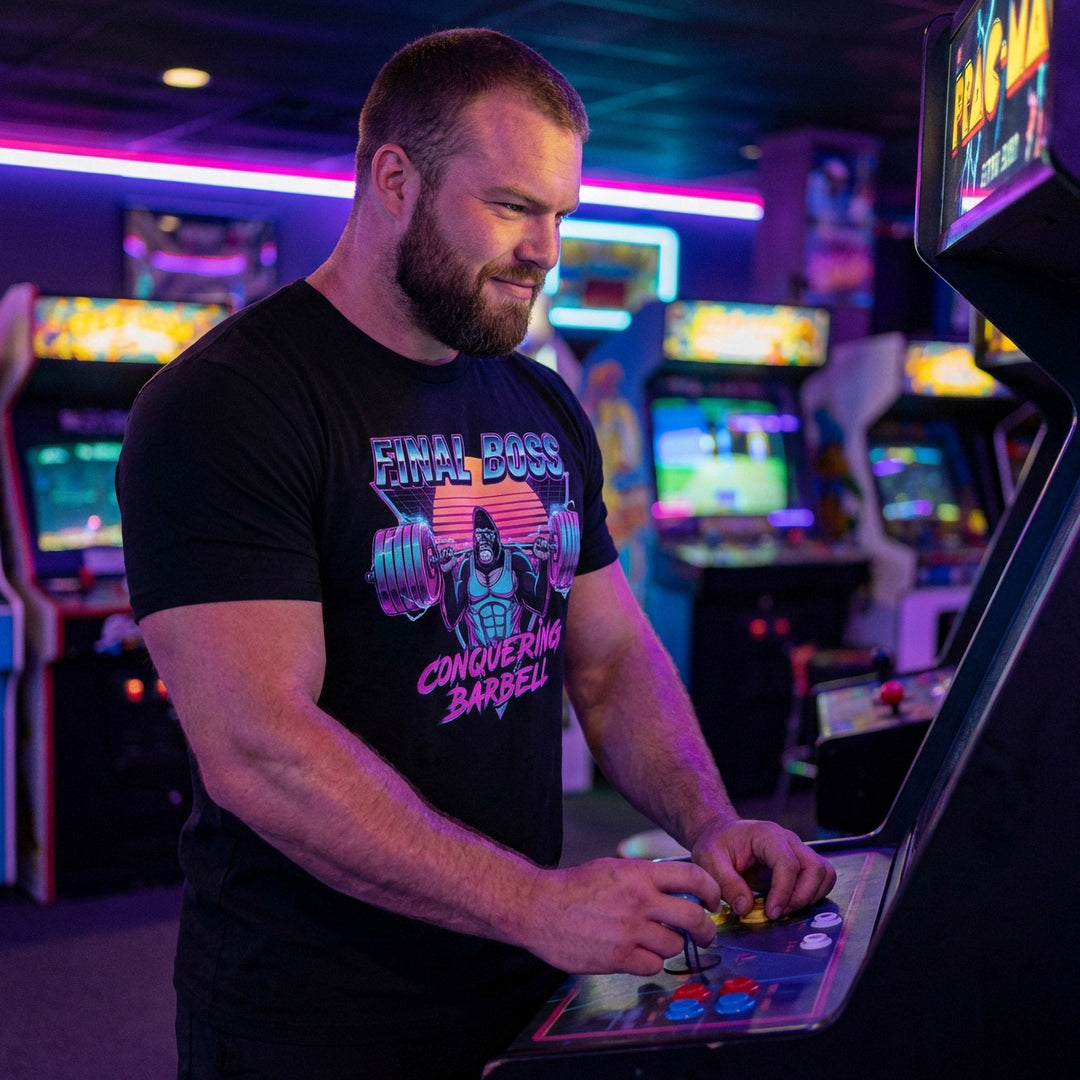 Final Boss tee in Black: a retro 80s-style gorilla squatting heavy against a neon sunset