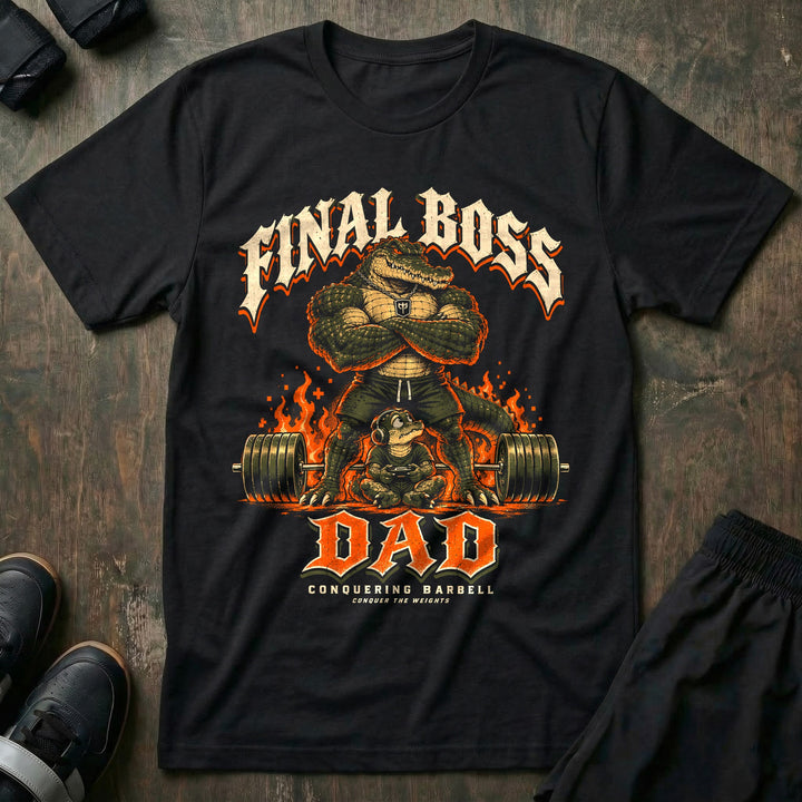 Final Boss Dad - Tee front graphic in Black with an alligator dad with crossed arms standing over a loaded barbell and flames while a young alligator with a headset plays a video game - Conquering Barbell
