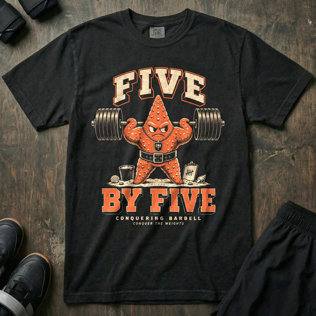Five by Five - Relaxed Fit Tee front graphic in Black with an orange starfish in a lifting belt flexing under a loaded barbell on the beach - Conquering Barbell