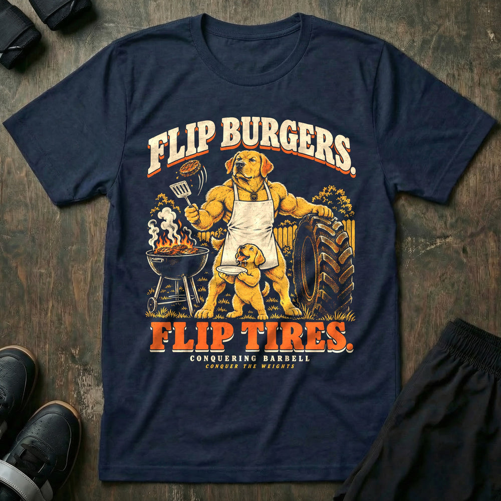 Flip Burgers. Flip Tires - Tee front graphic in Navy with a golden retriever dad in an apron flipping a burger at a grill while leaning on a tractor tire as a puppy holds a plate - Conquering Barbell