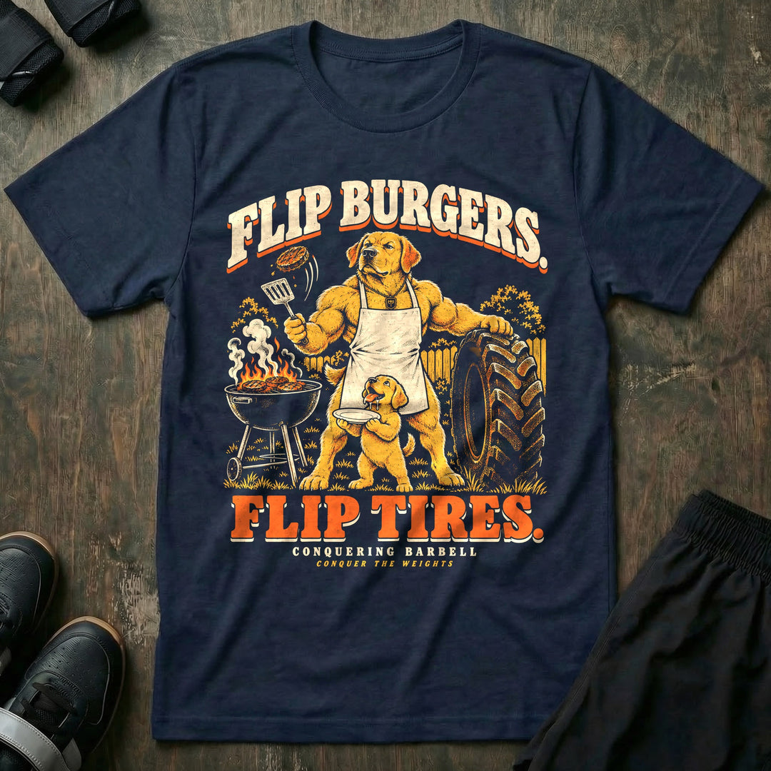 Flip Burgers. Flip Tires - Tee front graphic in Navy with a golden retriever dad in an apron flipping a burger at a grill while leaning on a tractor tire as a puppy holds a plate - Conquering Barbell