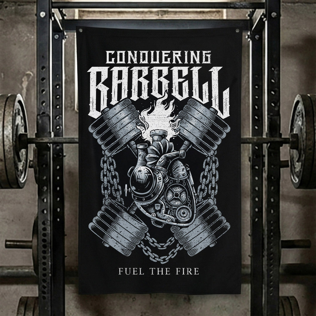 Fuel the Fire - Polyester Flag, vertical black gym flag with crossed engine pistons and a barbell wrapped in flame - Conquering Barbell