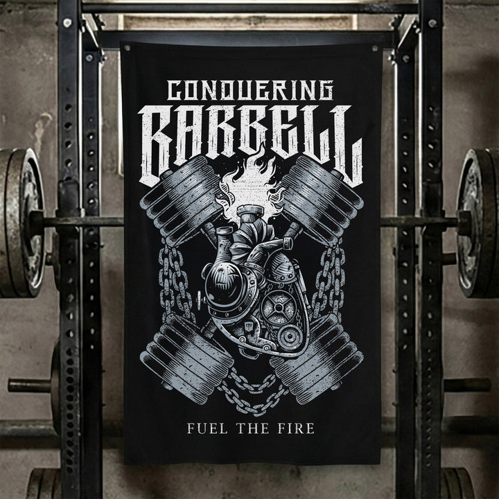 Fuel the Fire - Polyester Flag, vertical black gym flag with crossed engine pistons and a barbell wrapped in flame - Conquering Barbell