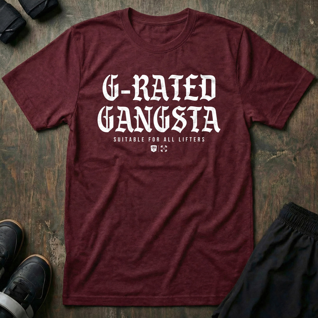 G-Rated Gangsta - Tee front graphic in Maroon with G-RATED GANGSTA in blackletter over SUITABLE FOR ALL LIFTERS and the Conquering Barbell shield - Conquering Barbell