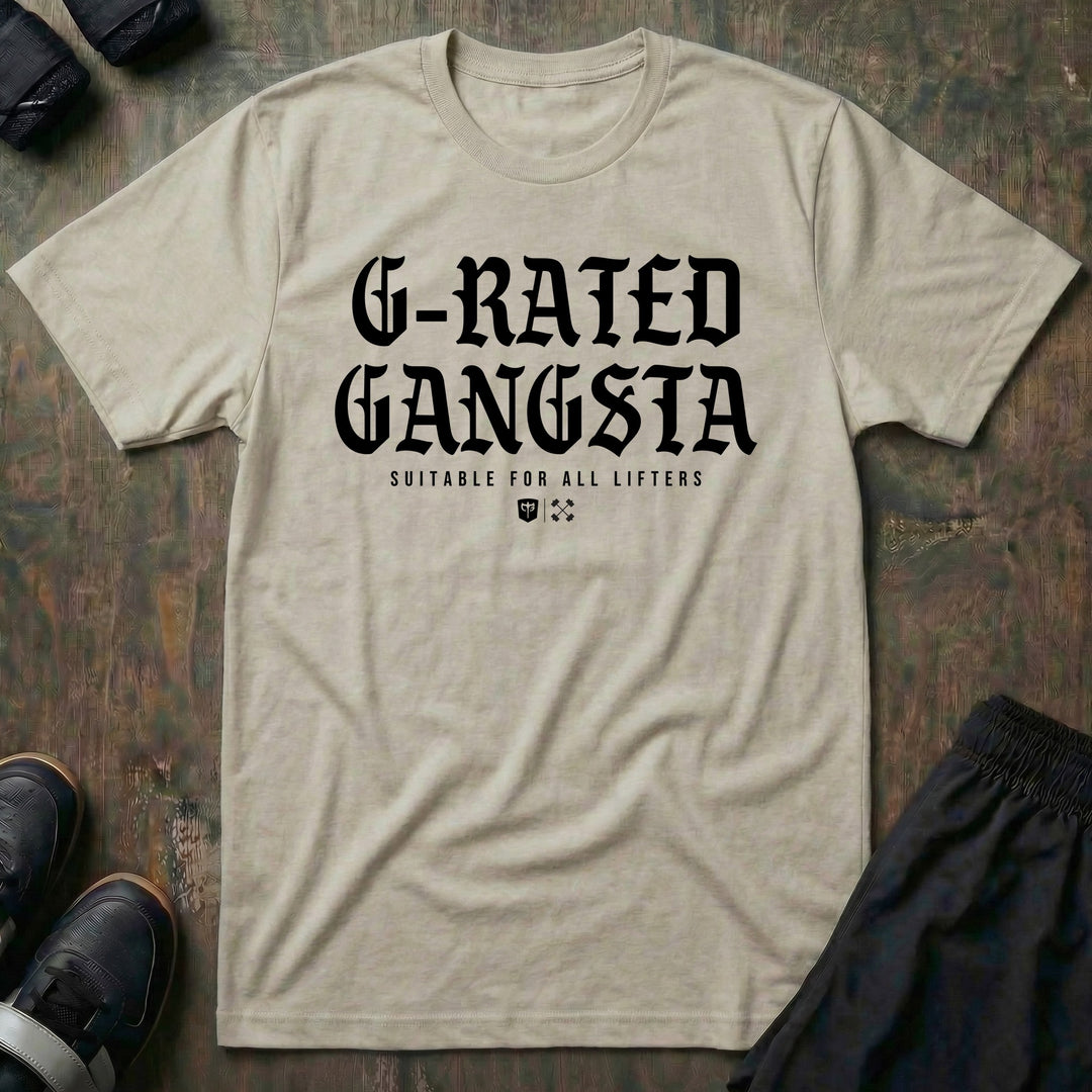 G-Rated Gangsta - Tee front graphic in Sand with G-RATED GANGSTA in blackletter over SUITABLE FOR ALL LIFTERS and the Conquering Barbell shield - Conquering Barbell