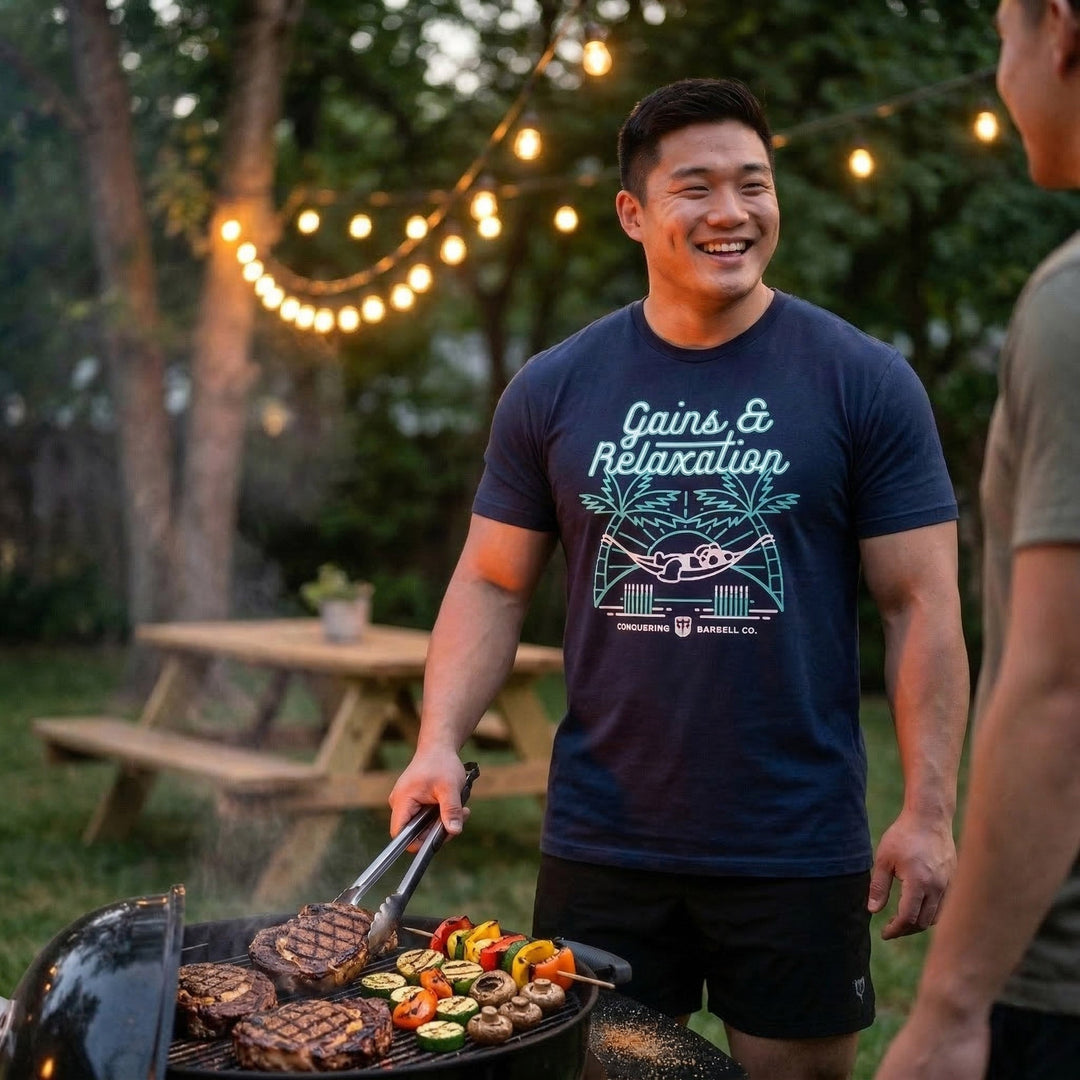 Gains &amp; Relaxation tee in Navy: a panda relaxing in a hammock strung between two barbells