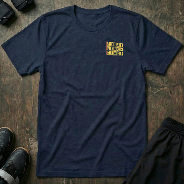 Gainz House tee: a retro diner sign stacked with SQUAT BENCH DEADS in bold yellow lettering