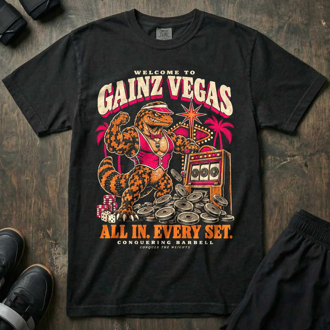 Gainz Vegas - Relaxed Fit Tee front graphic in Black with a lounge lizard in a pink vest hitting a slot machine jackpot of weight plates - Conquering Barbell