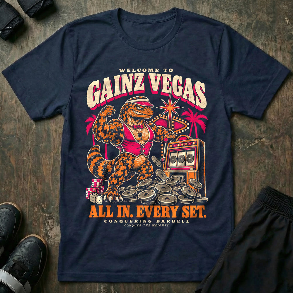 Gainz Vegas - Tee front graphic in Navy with a lounge lizard in a pink vest hitting a slot machine jackpot of weight plates - Conquering Barbell