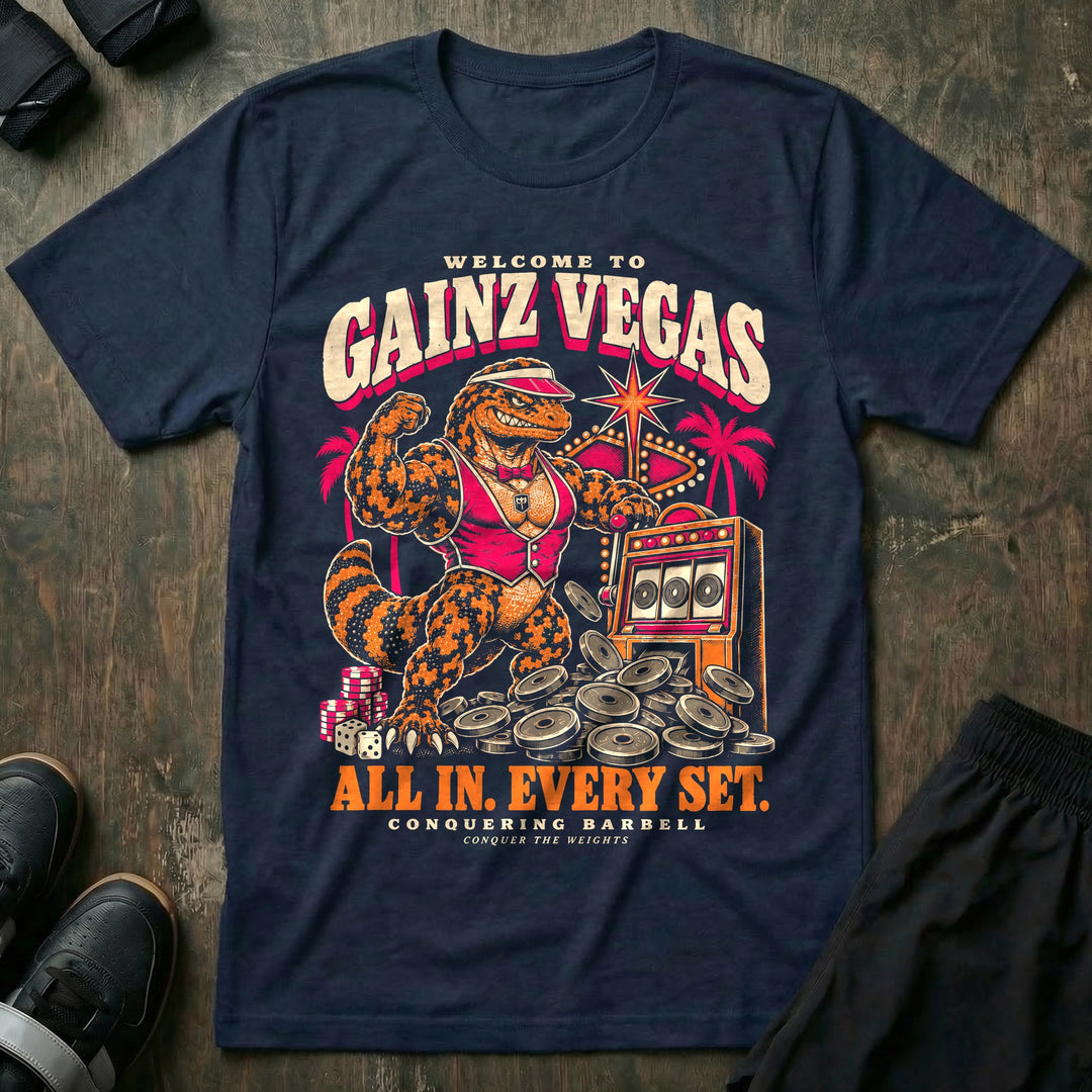 Gainz Vegas - Tee front graphic in Navy with a lounge lizard in a pink vest hitting a slot machine jackpot of weight plates - Conquering Barbell